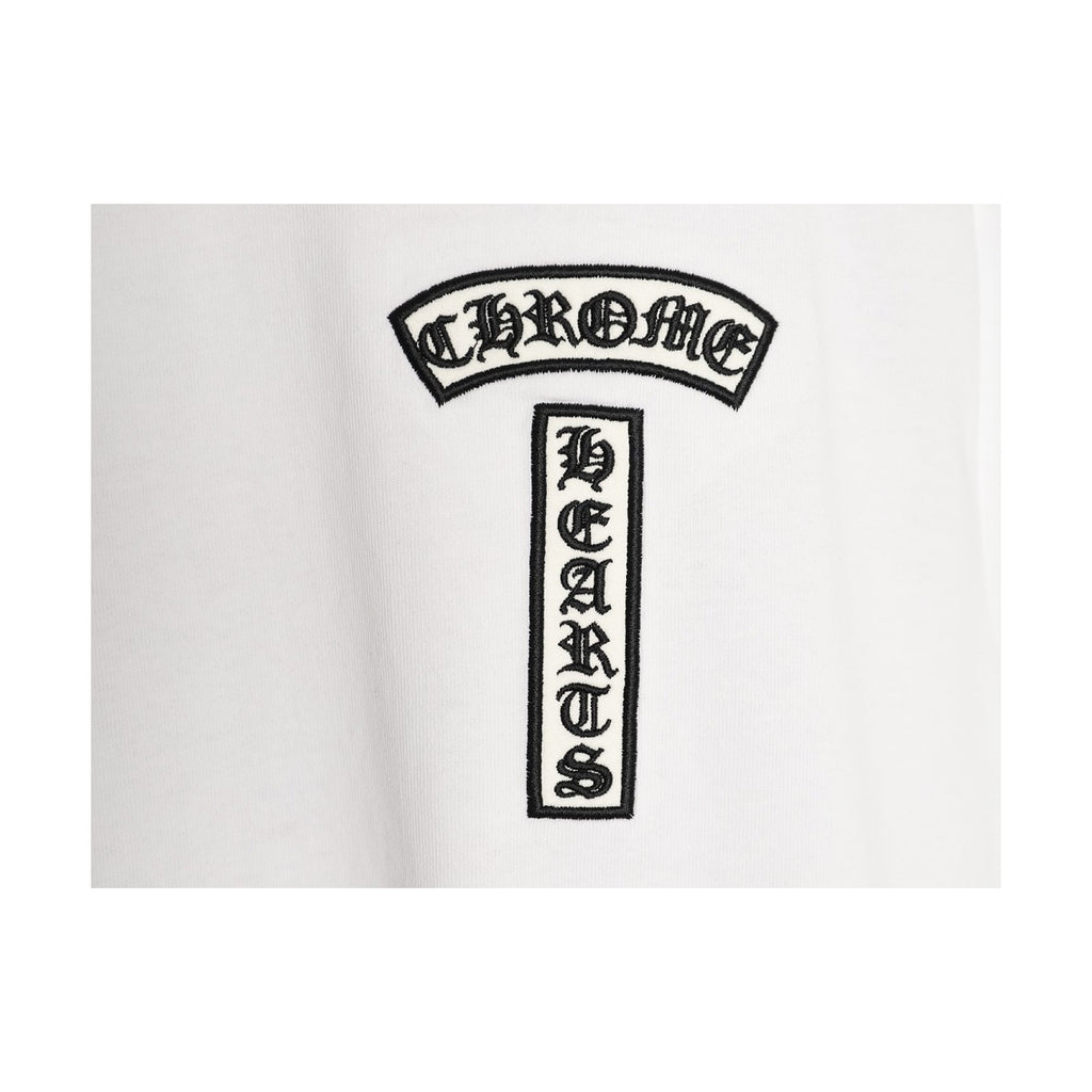 Chrome Hearts black chest emblem embroidery detail on white
