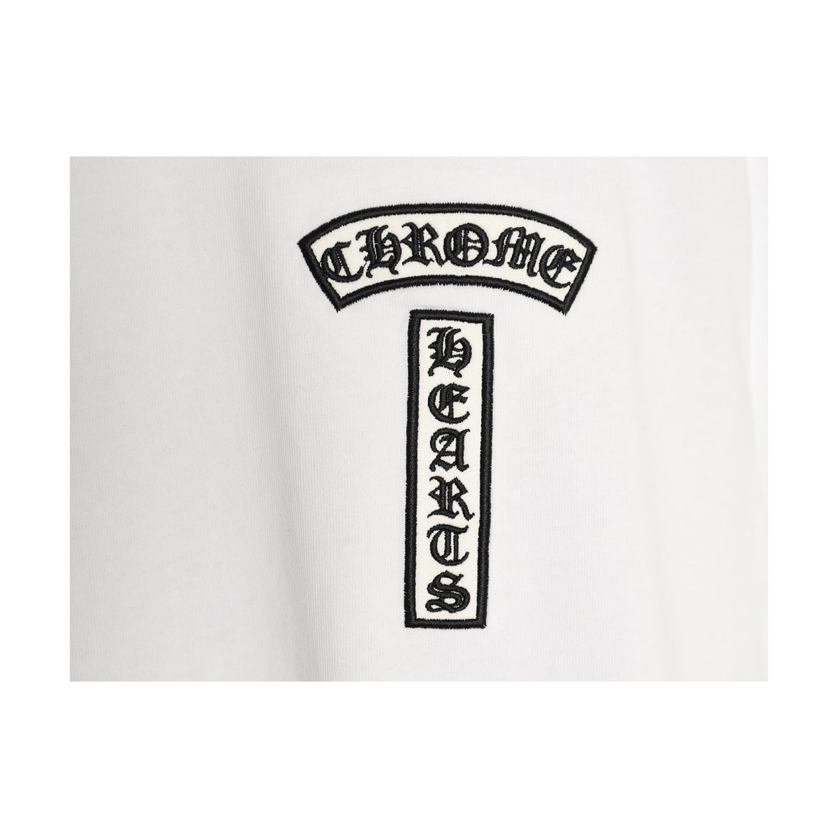 Chrome Hearts black chest emblem embroidery detail on white