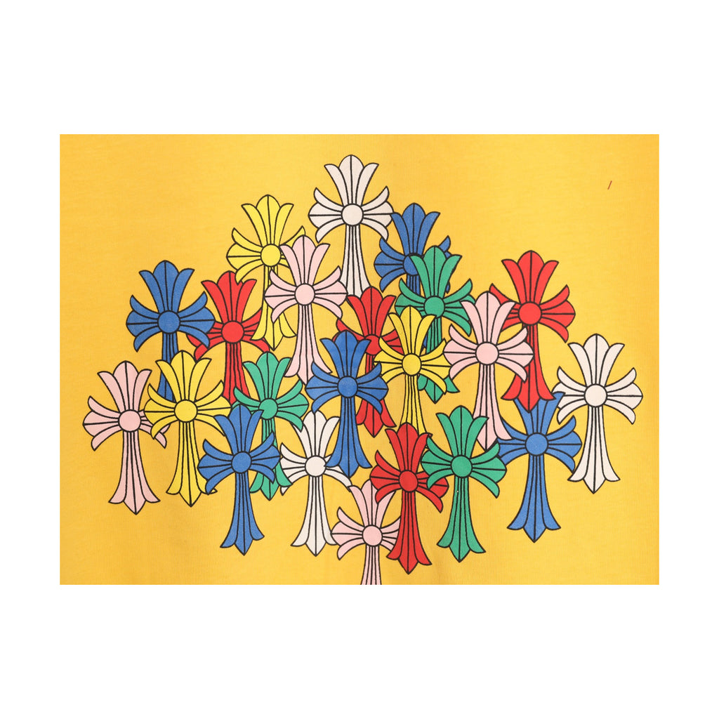Multicolor cross and floral print detail on yellow fabric