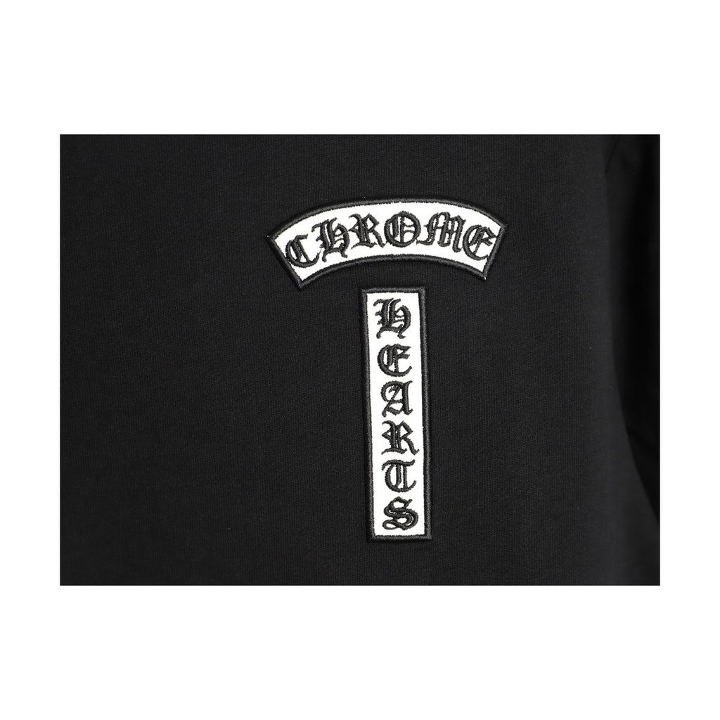 Chrome Hearts white chest emblem embroidery detail on black
