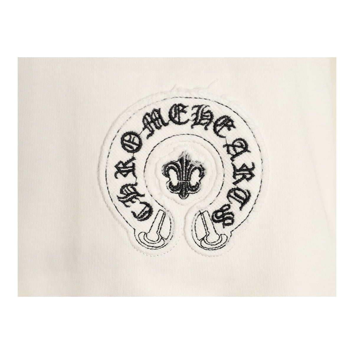 Chrome Hearts horseshoe fleur-de-lis chest embroidery detail on cream