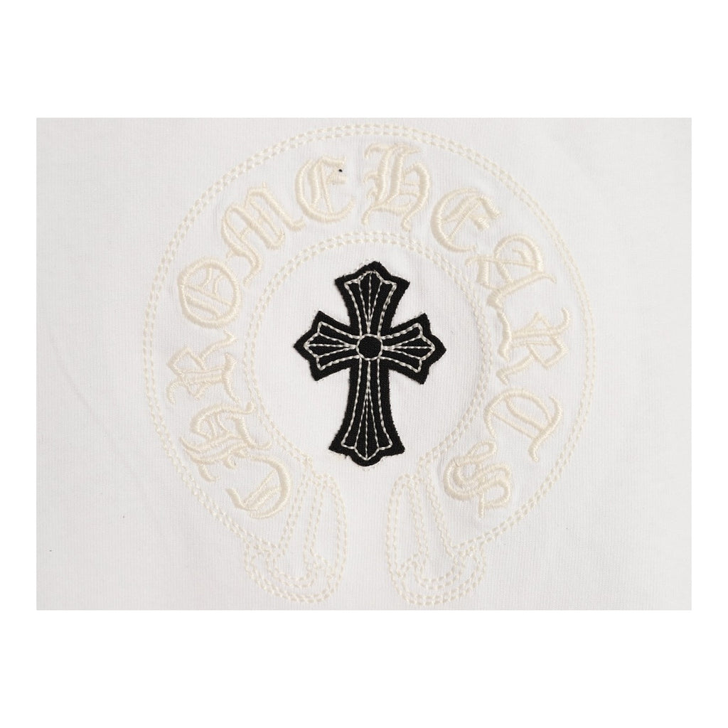 Chrome Hearts chest cross and Gothic script detail