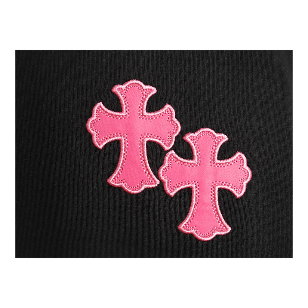 Chrome Hearts pink cross chest embroidery detail on black