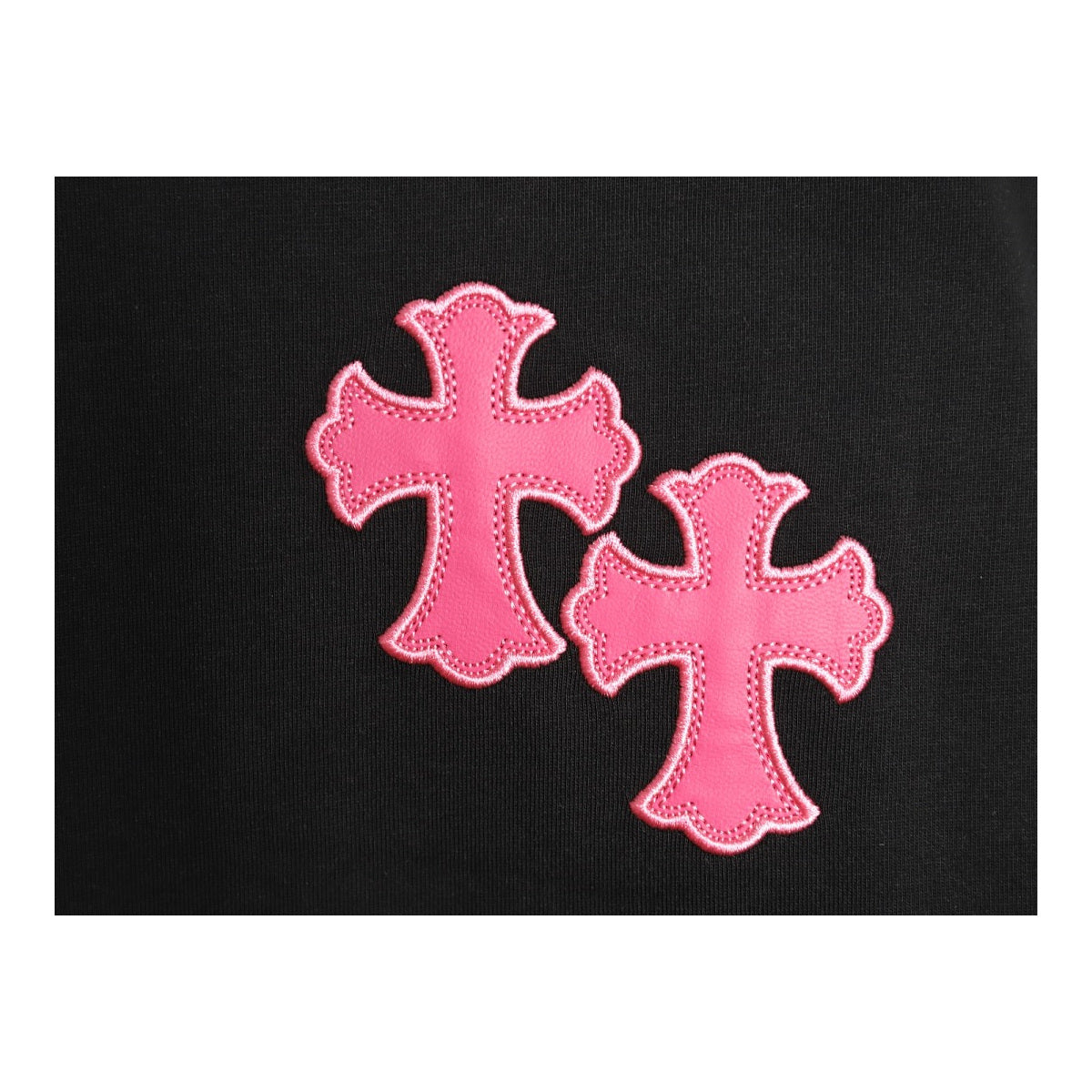 Chrome Hearts pink cross chest embroidery detail on black