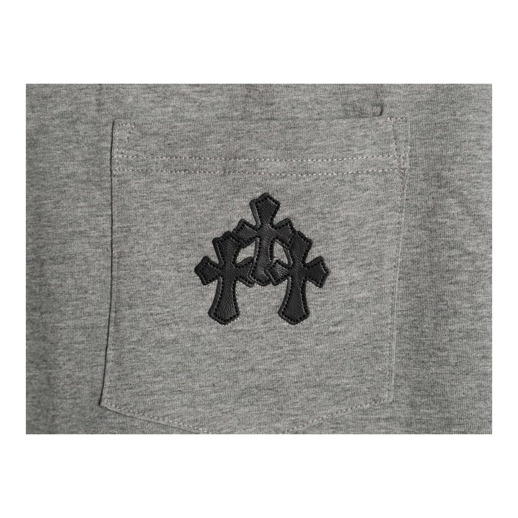 Chrome Hearts black leather chest monogram detail on gray