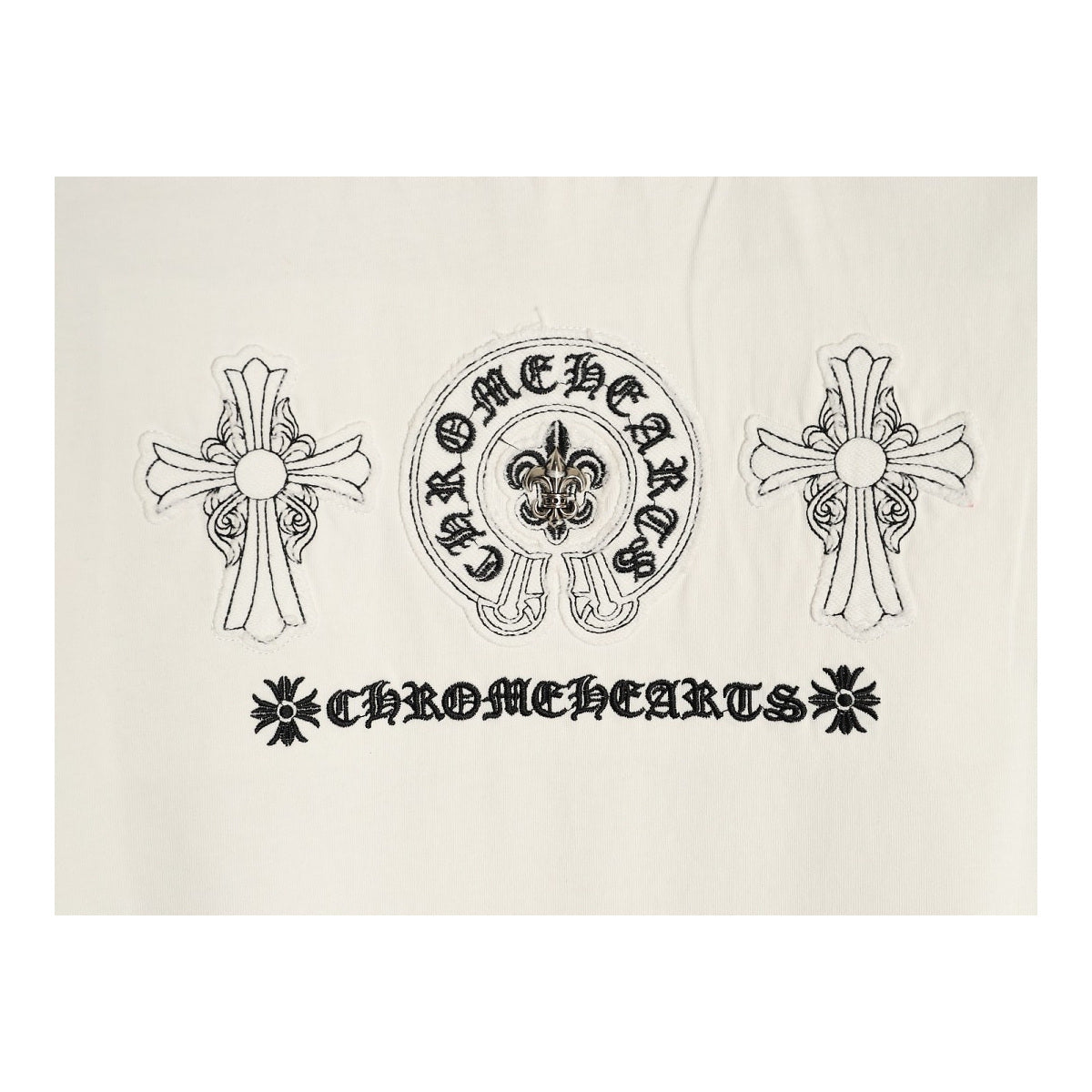 Chrome Hearts cross and horseshoe back embroidery detail on cream