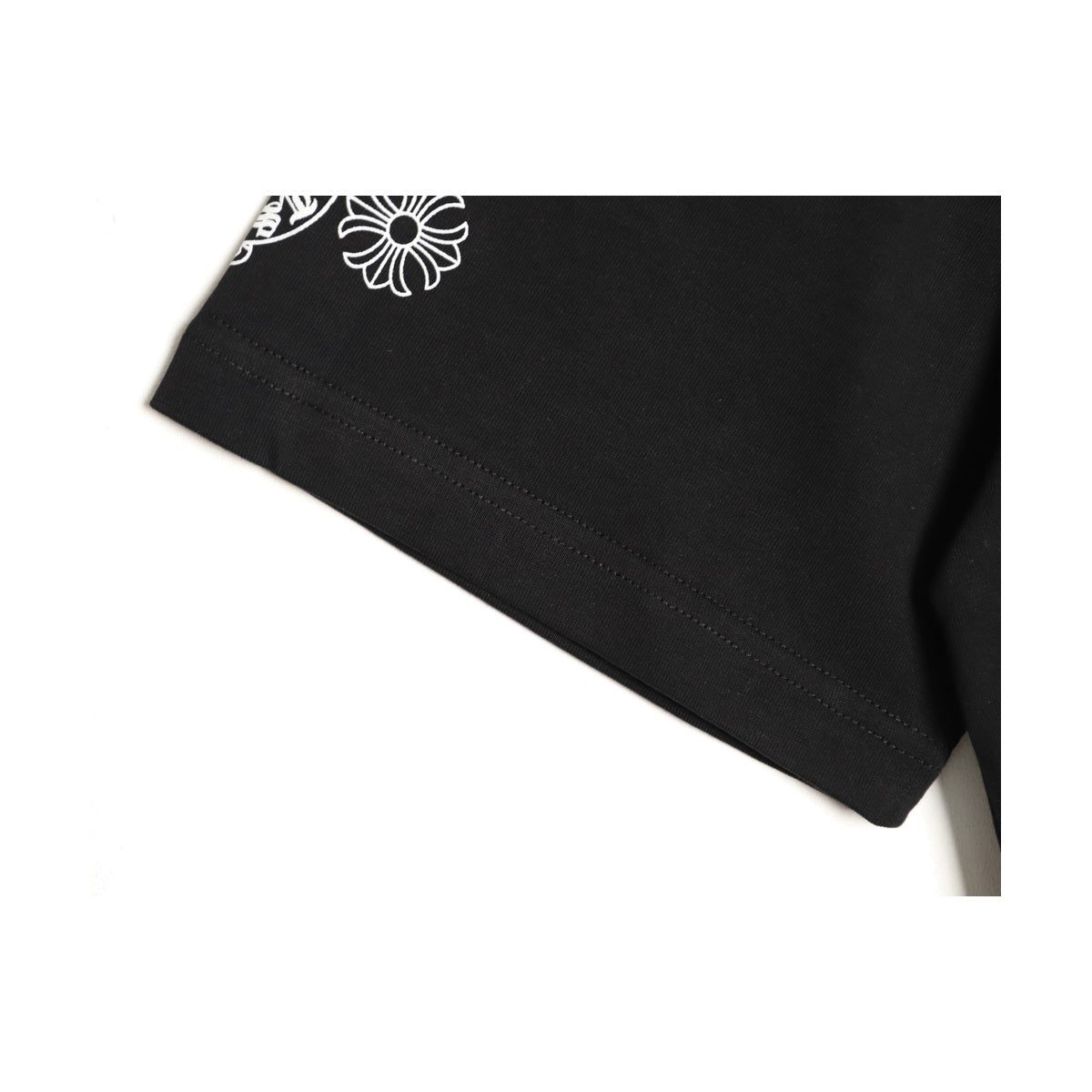 Chrome Hearts black sleeve emblem and fabric detail
