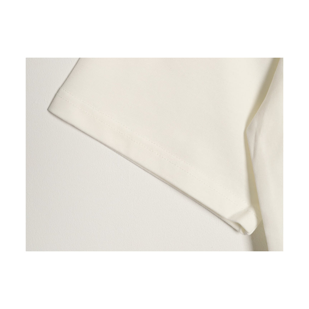 White cotton sleeve hem construction detail