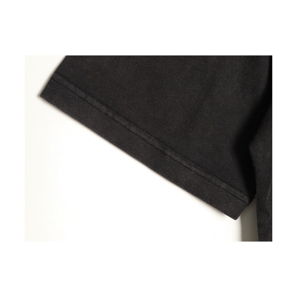 Washed black jersey fabric and seam detail