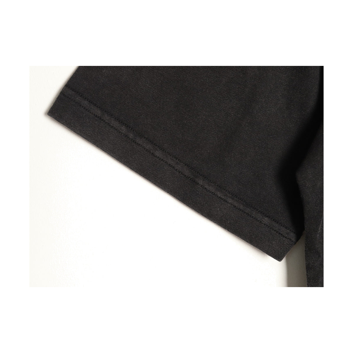 Washed black jersey fabric and seam detail