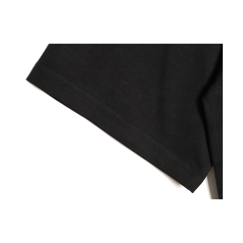 Black cotton sleeve hem construction detail