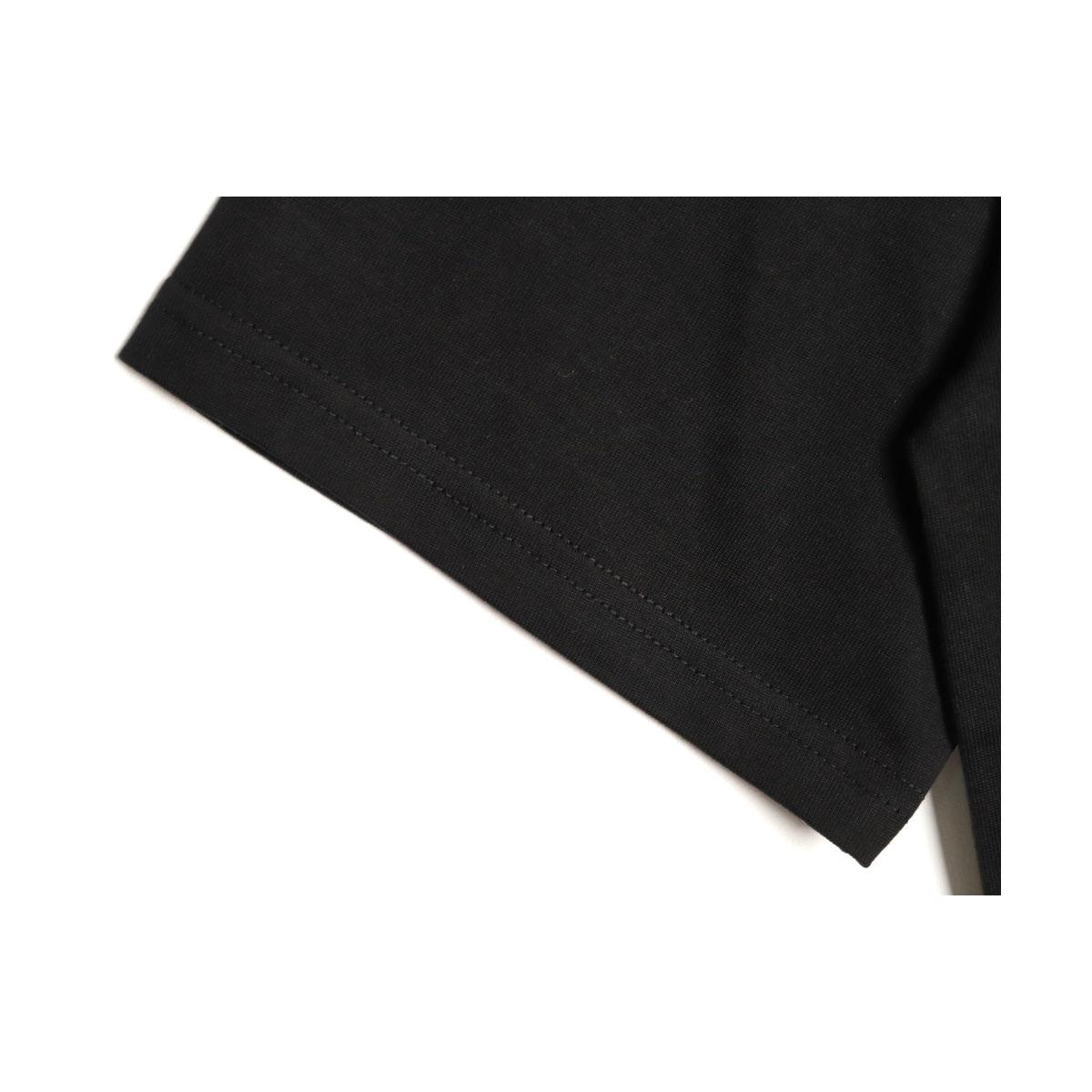 Black cotton sleeve hem construction detail