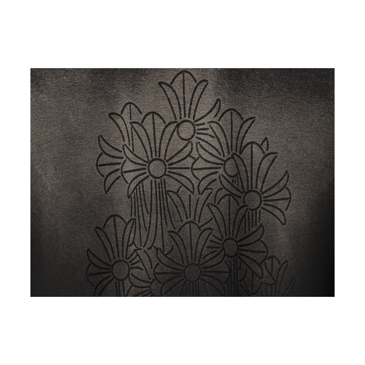 Chrome Hearts laser-burned floral cross graphic detail